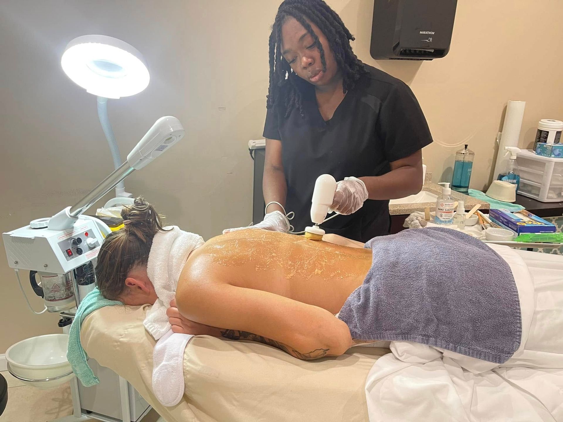 A woman is getting a massage at a spa.