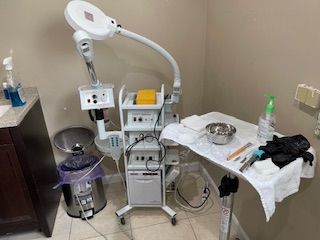 A room with a table and a lamp in it.