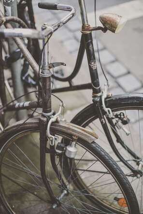 Two broken and rusted bikes