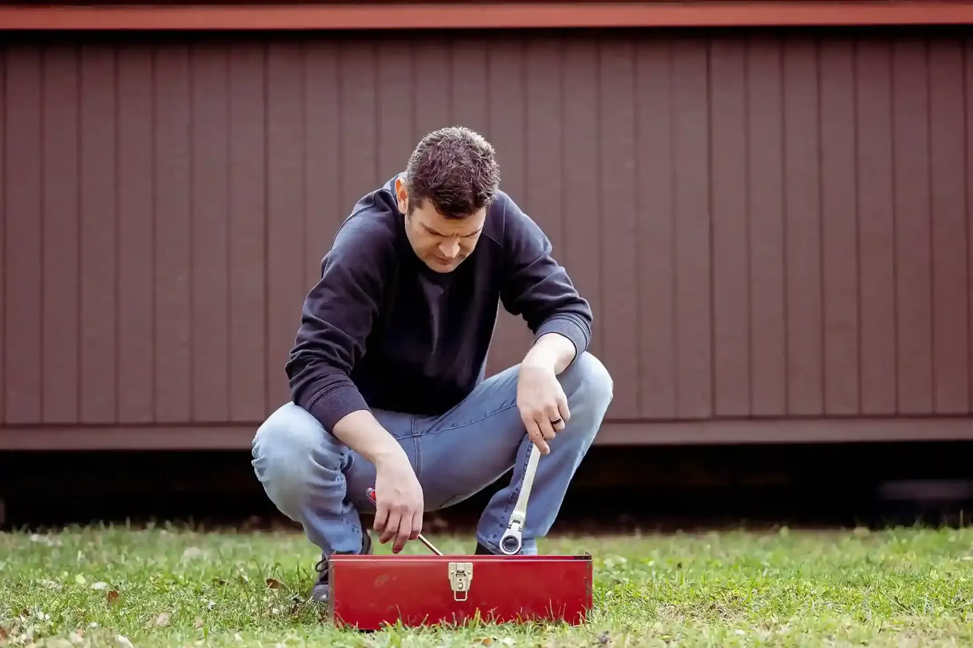 Rusty metal panels with peeling white paint, and white streaks.