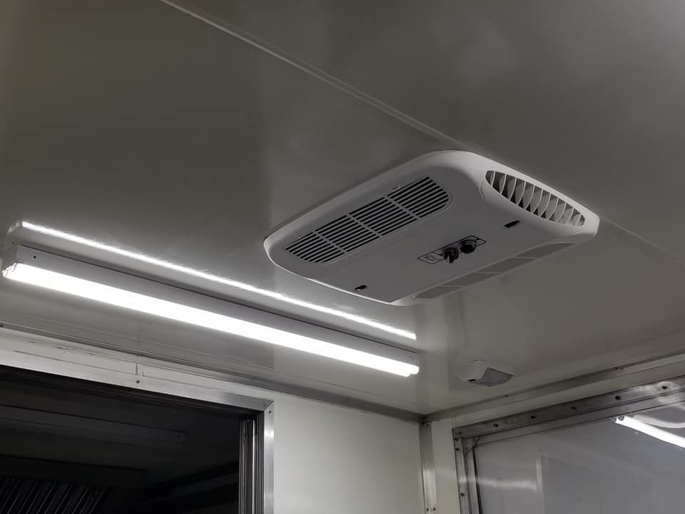A ceiling fan is hanging from the ceiling of a building.