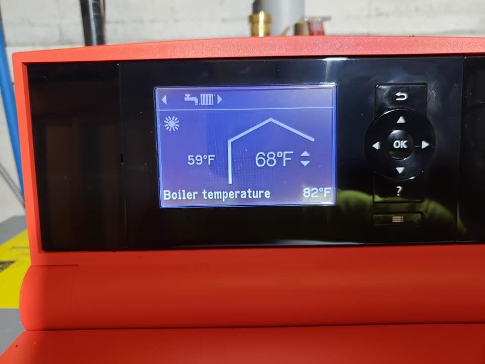 A digital display shows that the boiler temperature is 68 degrees
