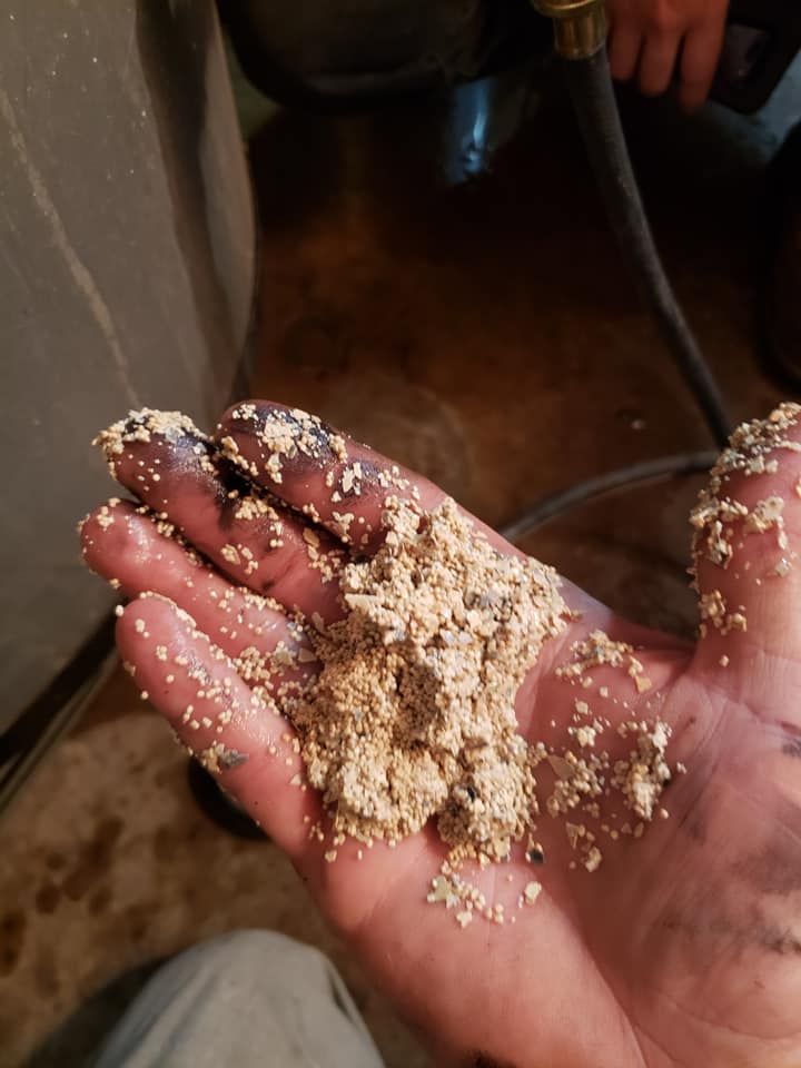 A person is holding a pile of dirt in their hand
