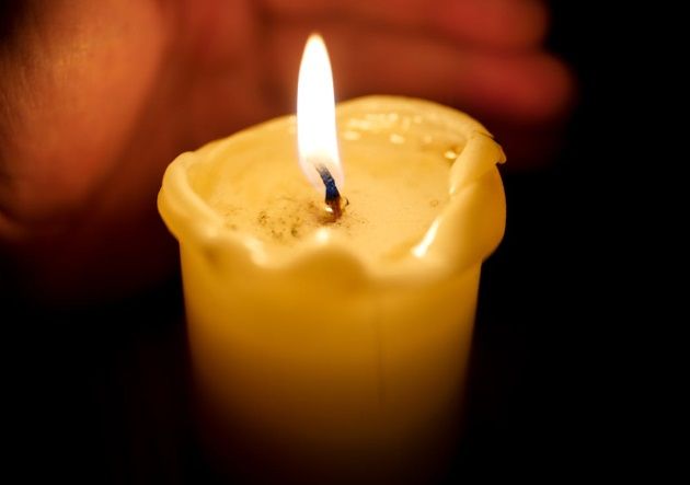 Glowing memorial candles representing compassionate care from funeral homes in Great Kills, NY.