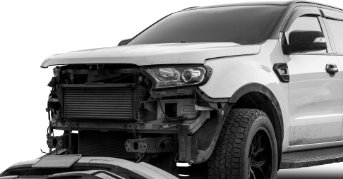 White truck with front bumper removed, revealing radiator and undercarriage. | Big n' Littles Auto Body