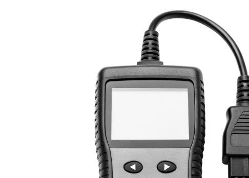 OBD2 code reader with blank screen, connected by a cable, isolated on white background. | Big n' Littles Auto Body