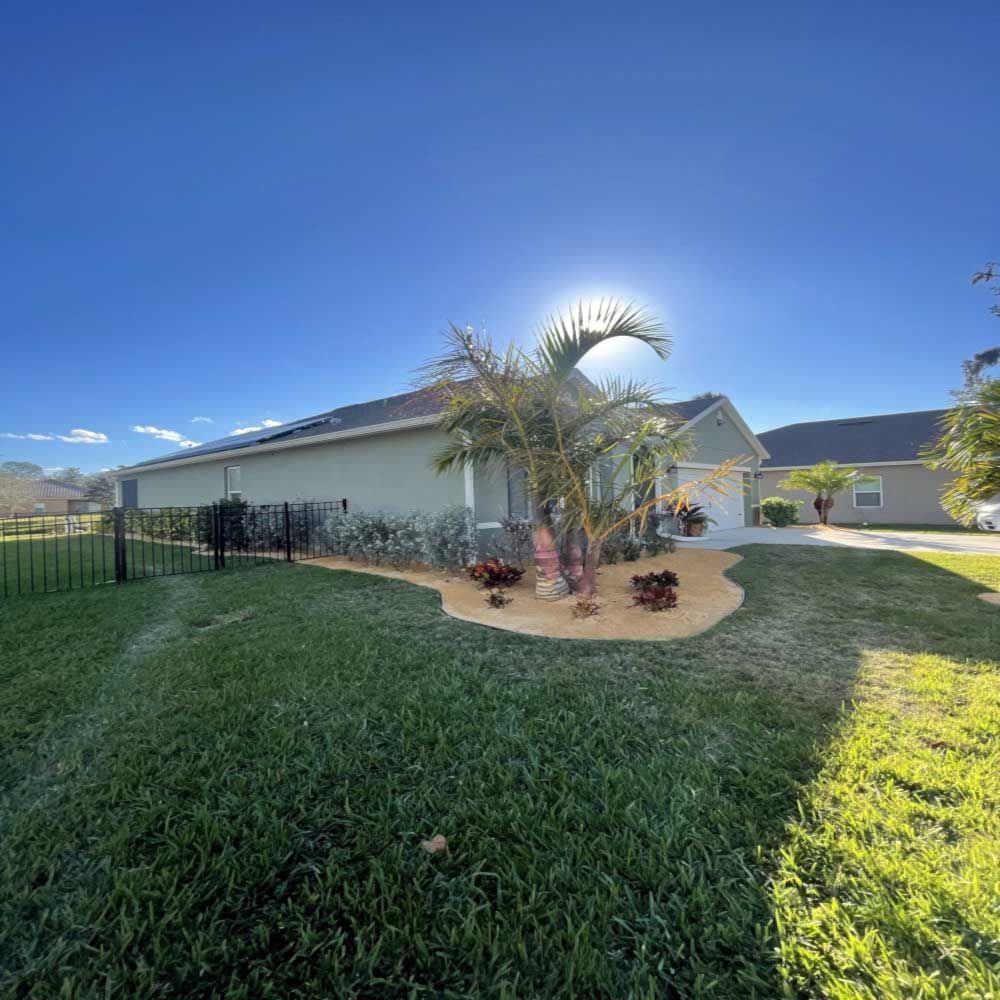 A house with a lot of grass in front of it