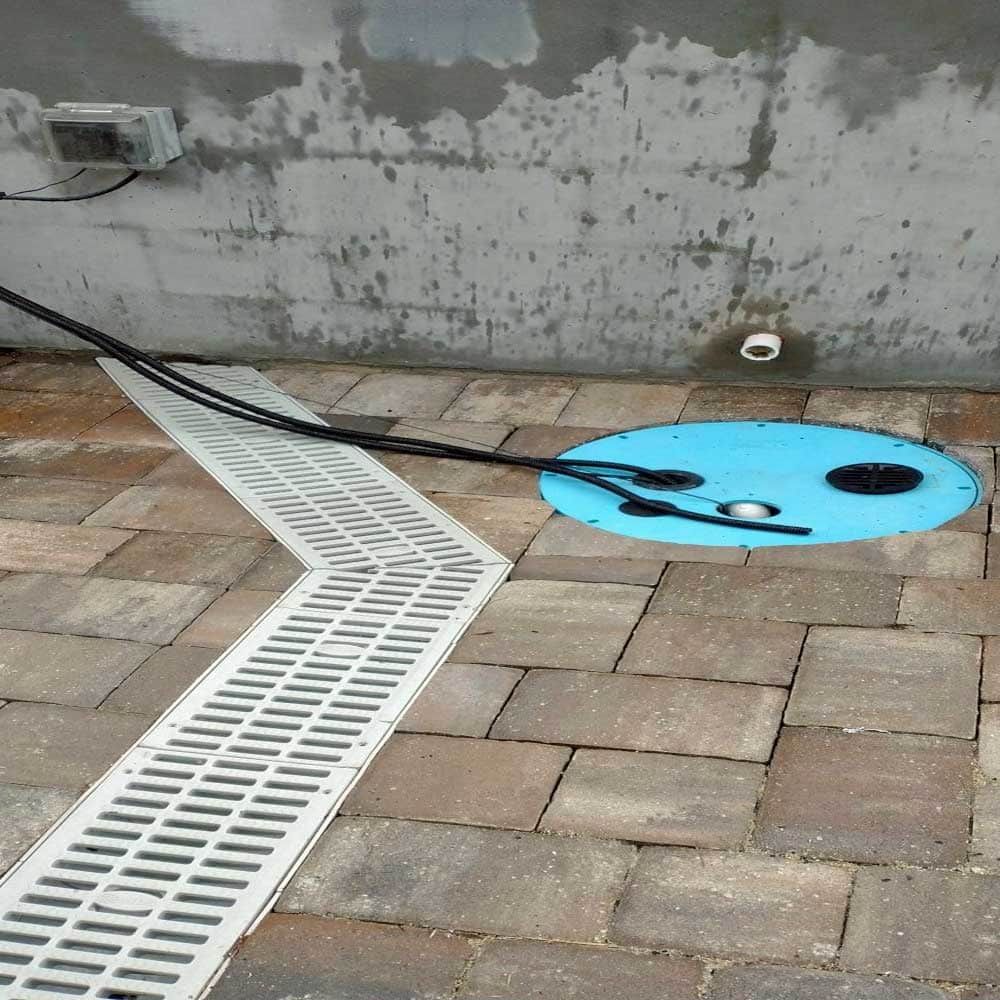A drain with a blue hole in the middle of it
