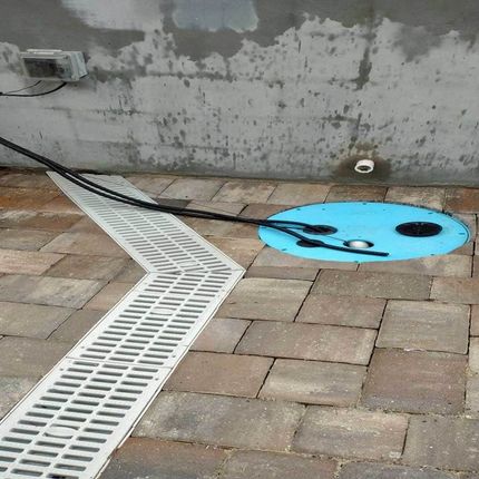 A drain with a blue hole in the middle of it