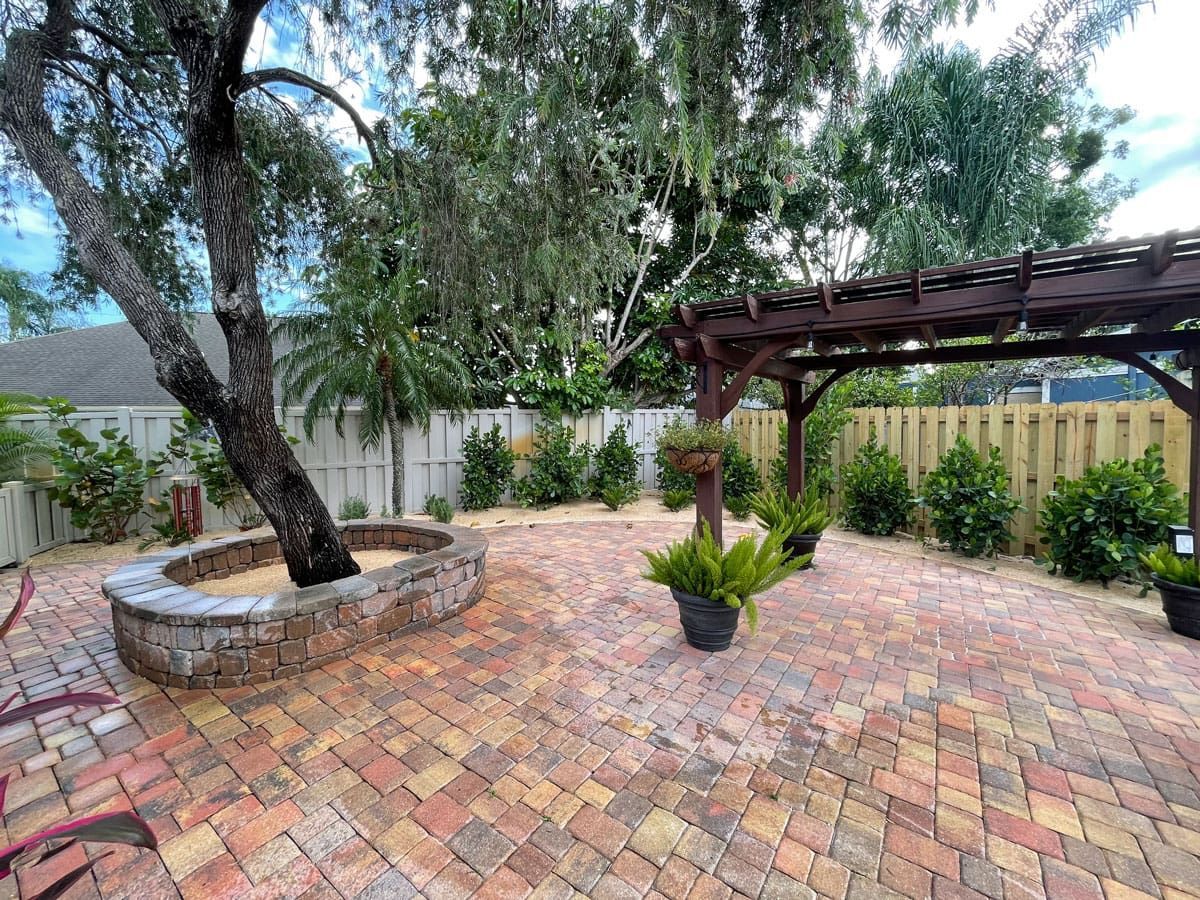 There is a fire pit in the middle of the patio.