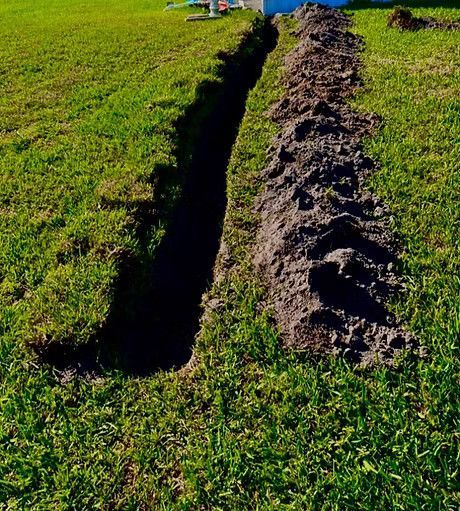 A large hole in the ground for an irrigation system
