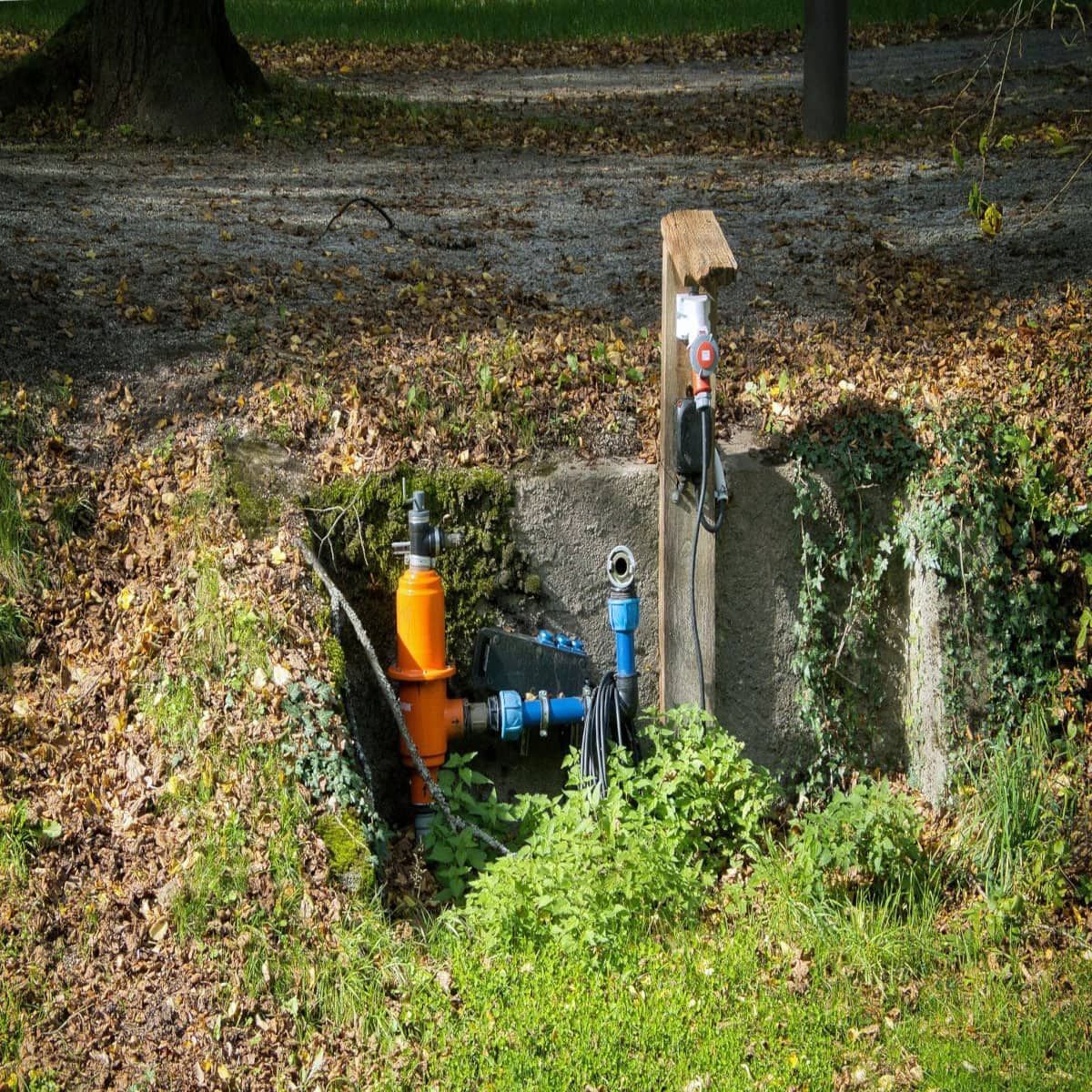 An orange pipe is connected to a blue pipe