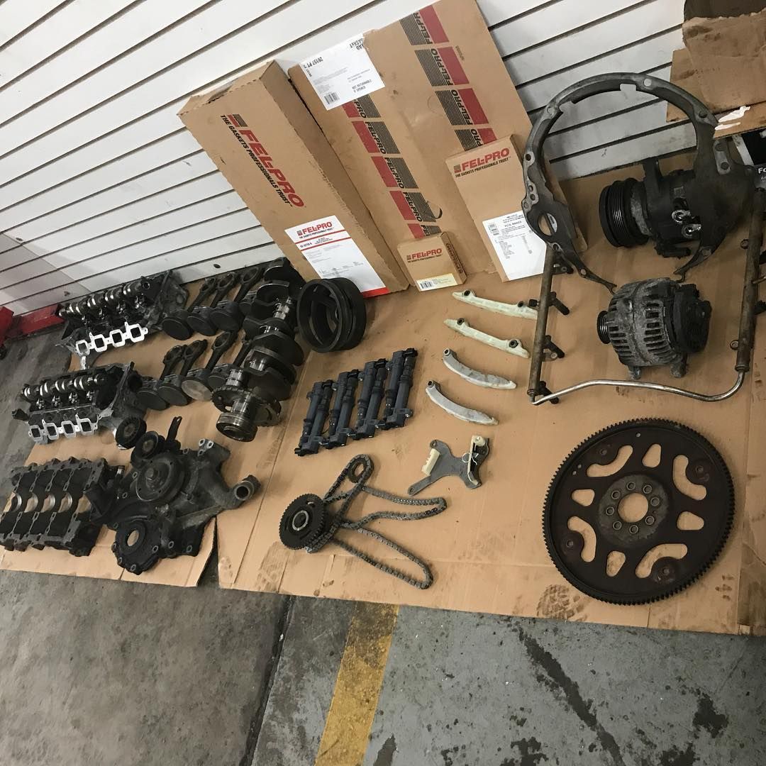 A bunch of car parts are laying on a table