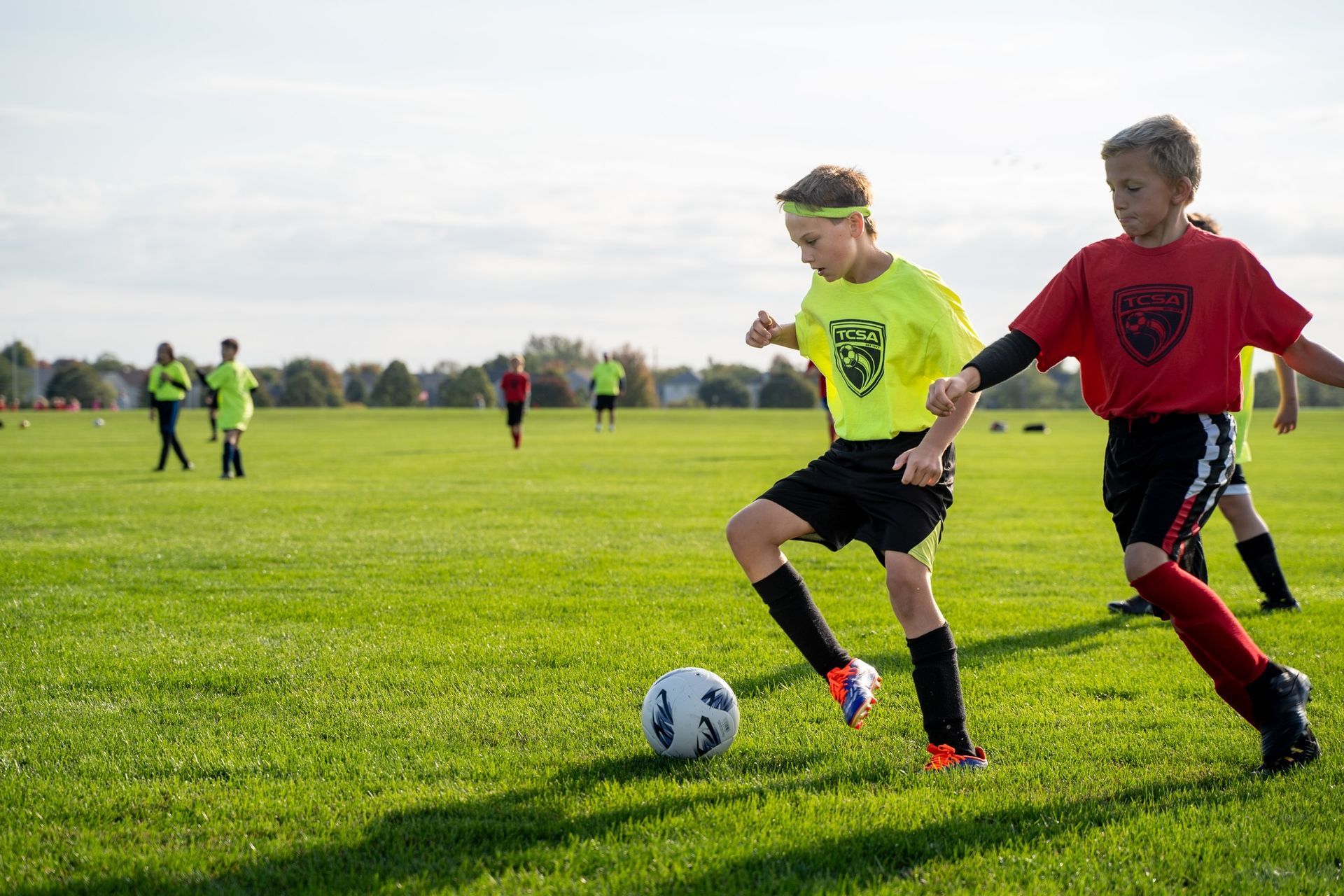 Young boys are playing soccer for Tri-Cities Soccer Association