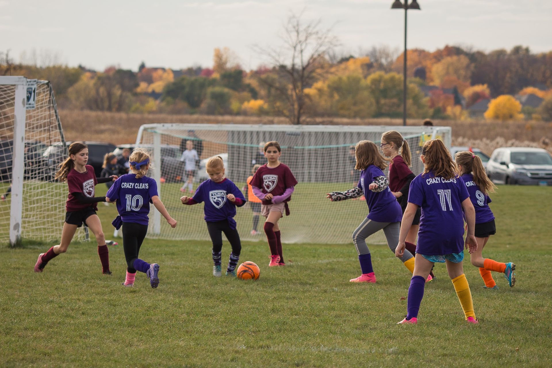Young girls are playing soccer for Tri-Cities Soccer Association