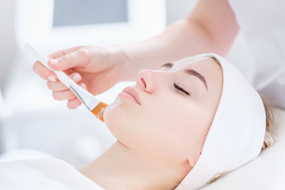 Person Receiving Facial Treatment with A Brush in A Spa Setting — Beauty In Profile In Salamander Bay, NSW