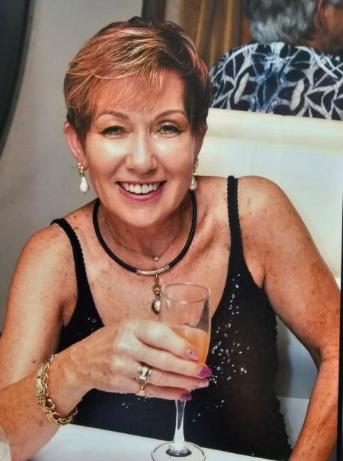 Woman with Short Blonde Hair, Smiling, Holding a Champagne Glass — Beauty In Profile In Salamander Bay, NSW