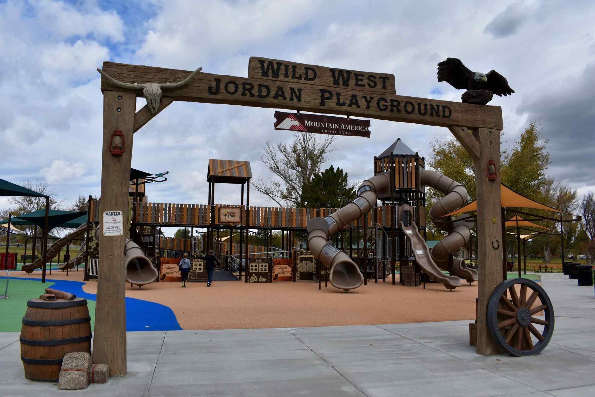 A playground with a sign that says wild west jordan playground