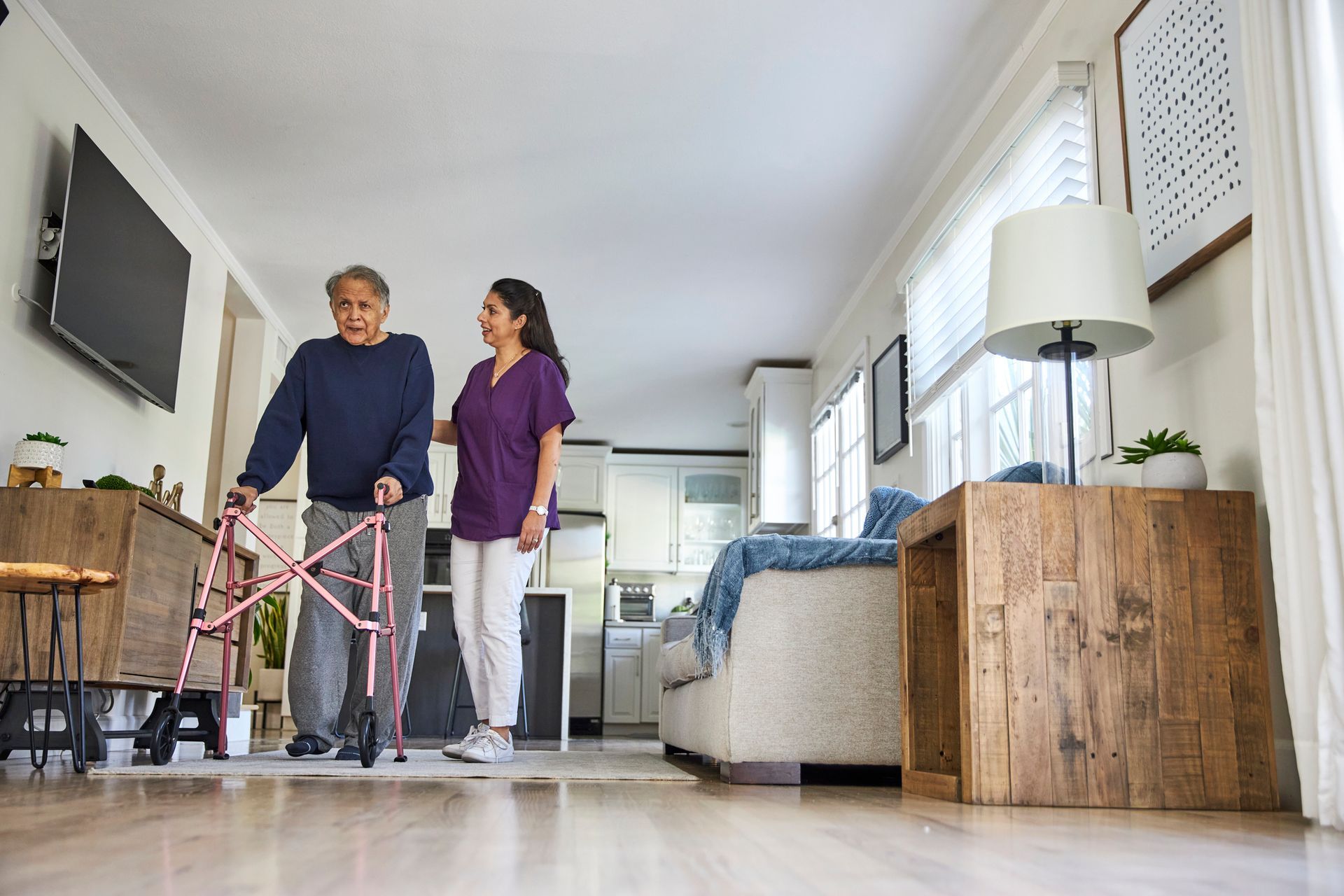A man in a green shirt is giving an older man a massage - New City, NY - A & T Certified