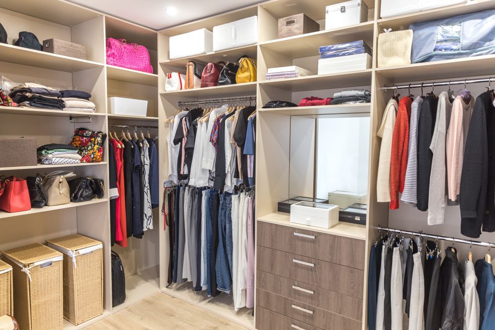 A Walk in Closet Filled With Lots of Clothes and Bags — JPR Concepts in Burleigh Heads, QLD