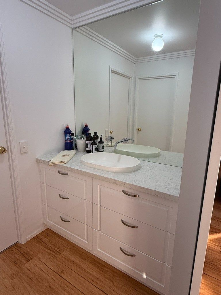 A Bathroom With a Sink and a Large Mirror — JPR Concepts in Burleigh Heads, QLD