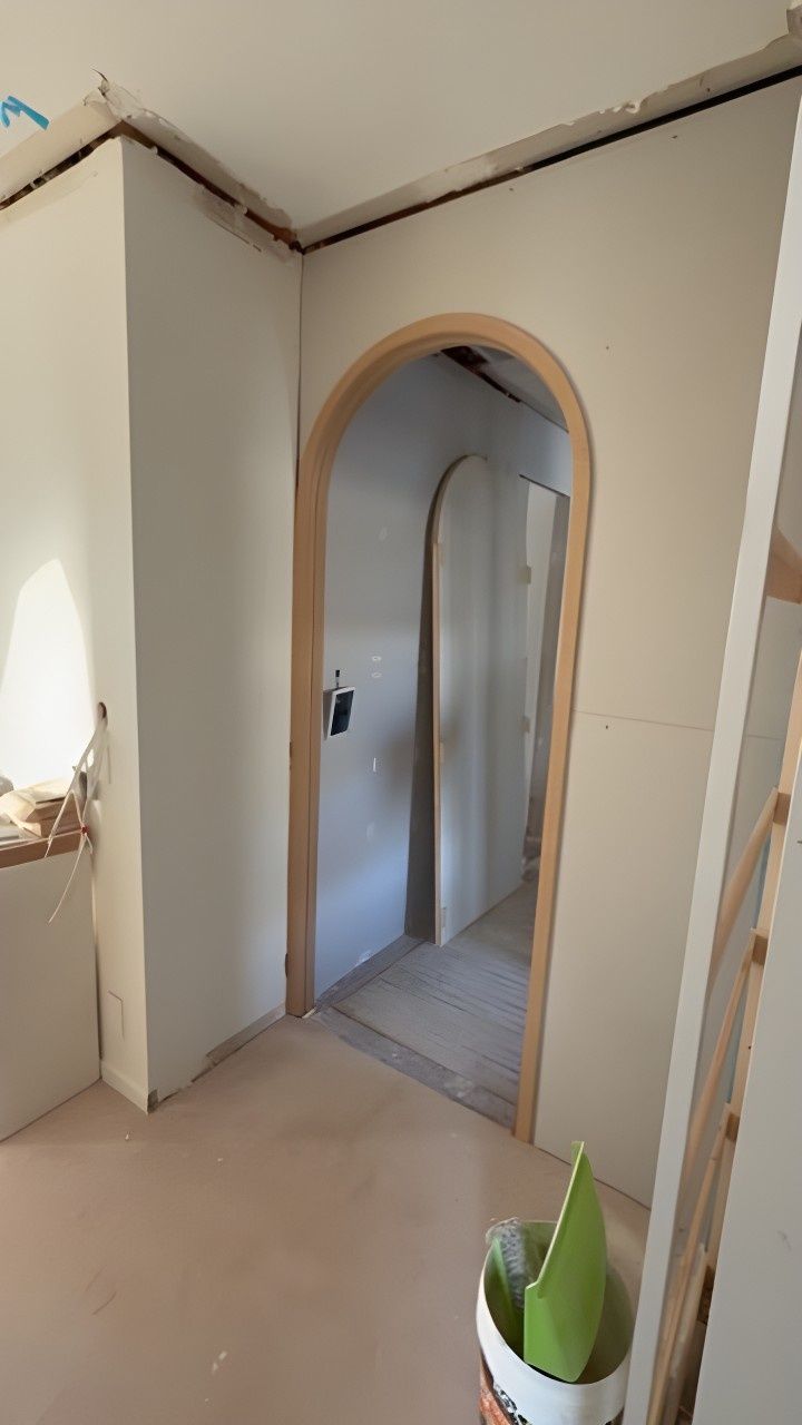 A Room With a Wooden Archway Leading to a Hallway — JPR Concepts in Burleigh Heads, QLD