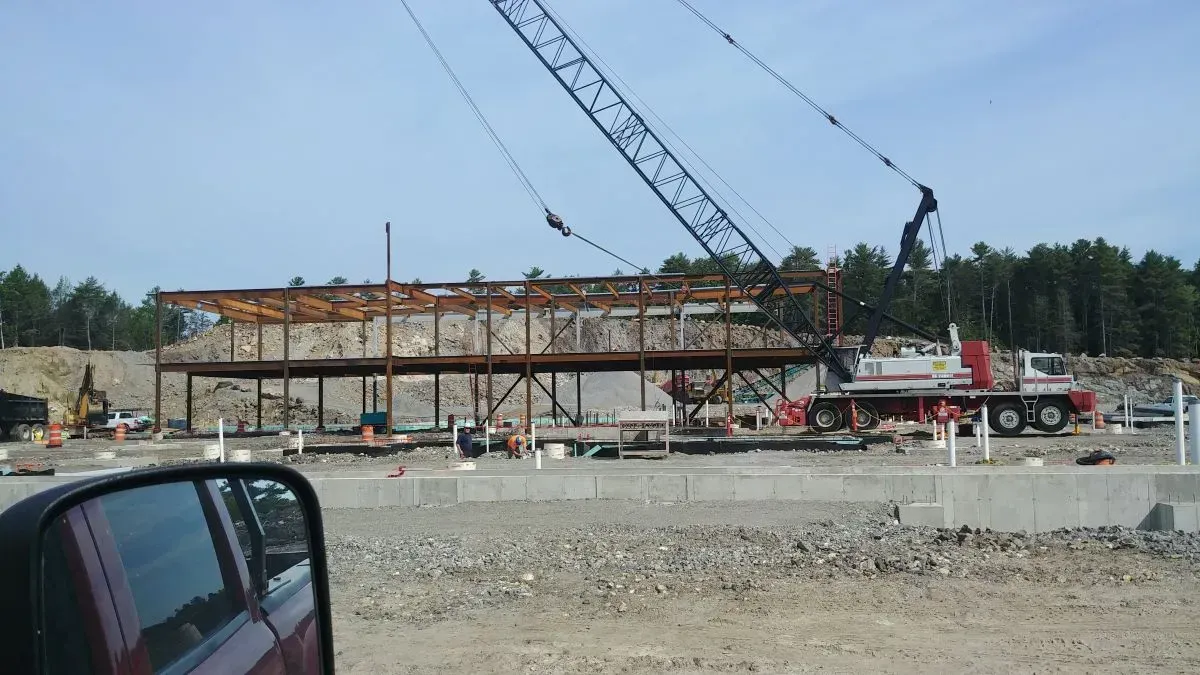 A large crane is being used to build a bridge