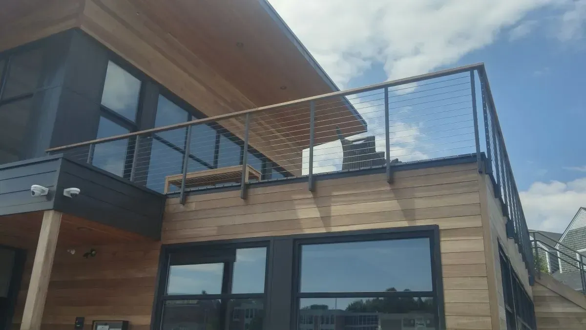 A large house with a balcony on top of it.