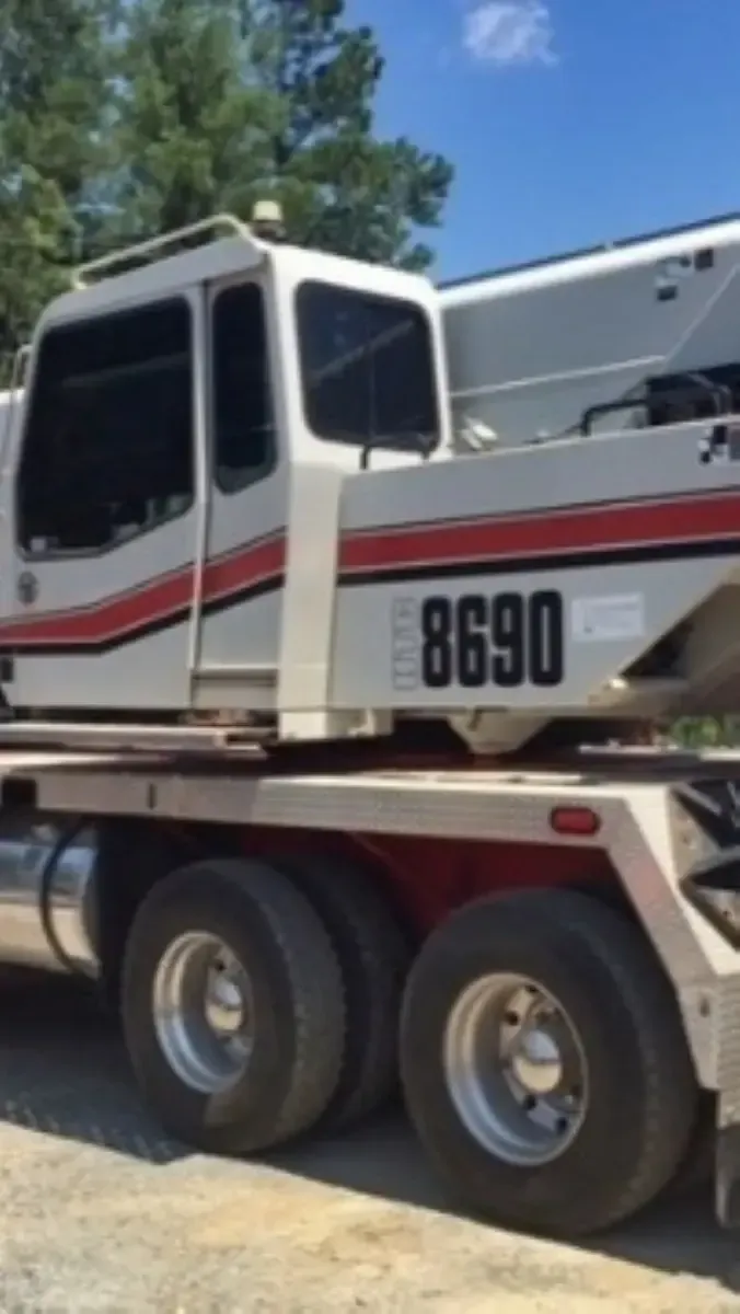 A white truck with the number 8690 on the side