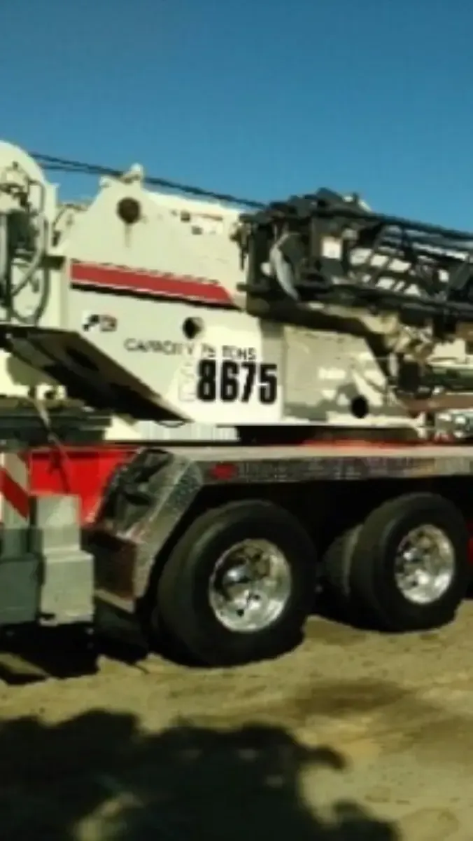 A white truck with the number 8675 on the side