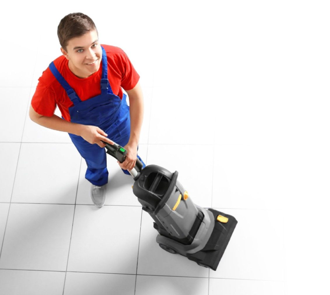 man vacuuming floor top view