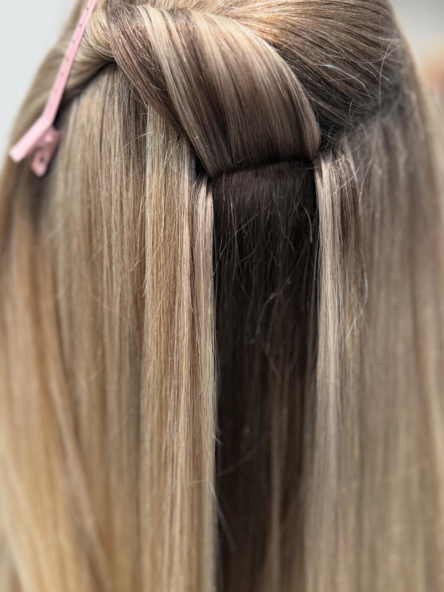 Blonde Hair Styled In A Side Ponytail With A Knot, Sitting In A Salon Chair — That Printed Vinyl Place in Heatley, QLD