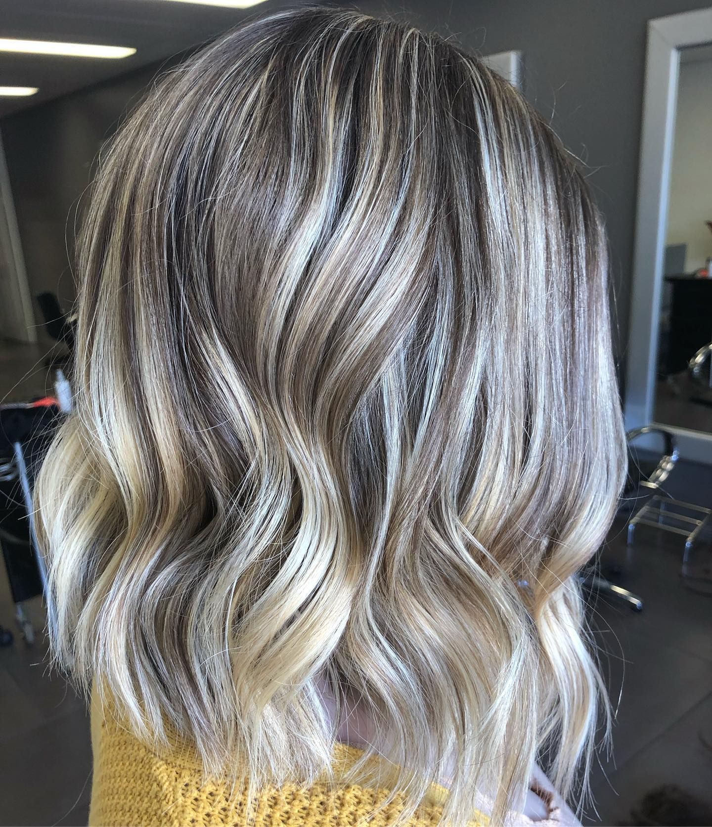 Close-up of Wavy, Layered Hair With Blonde and Brown Highlights — Salon South in Mount Sheridan, QLD