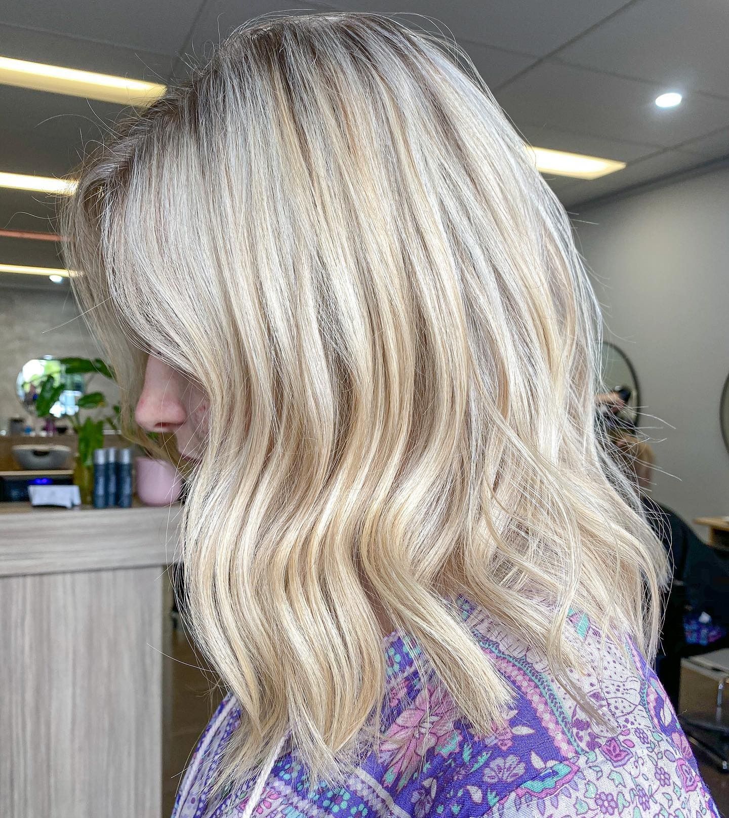 Blonde Wavy Hair With Highlights. Woman in a Salon Setting — Salon South in Mount Sheridan, QLD