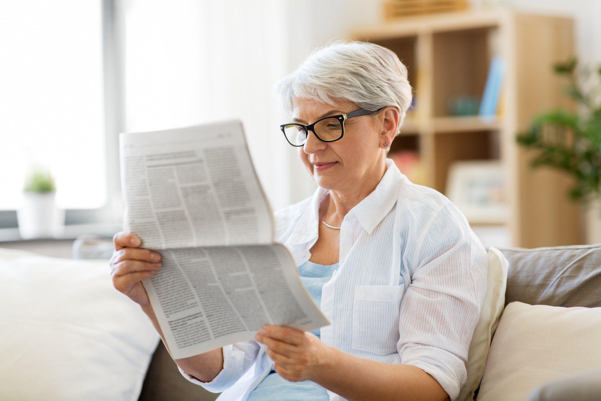 Woman reading a newspaper