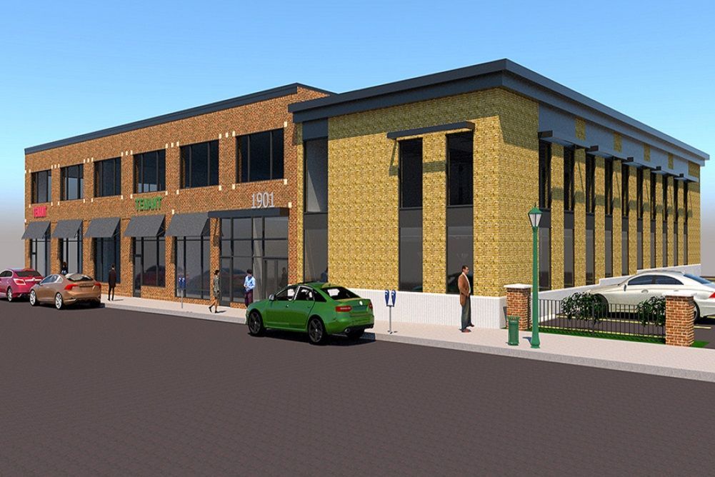 Modern two-story brick commercial building on a street, with parked cars and pedestrians outside.