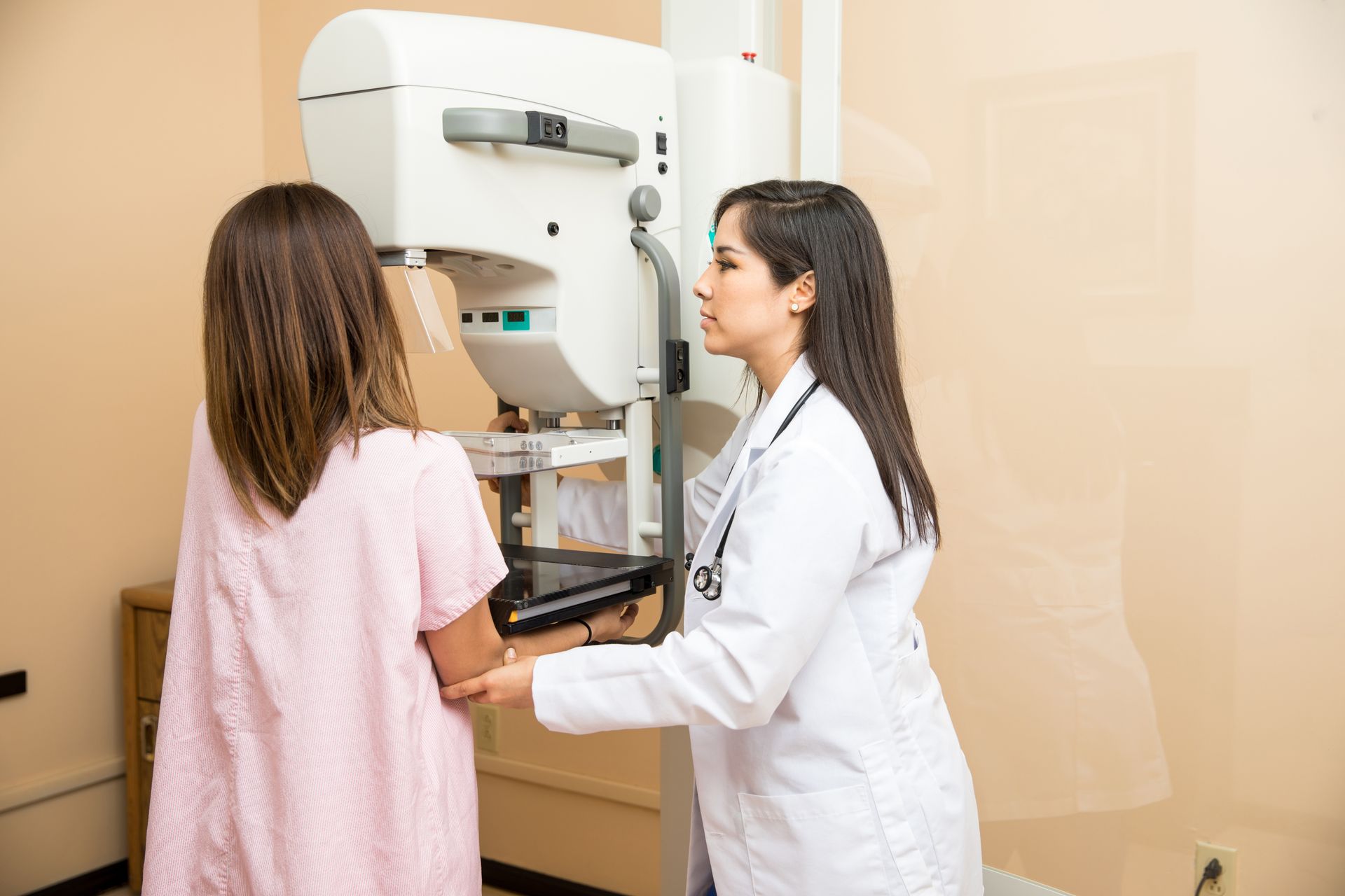 A woman is getting a mammogram.