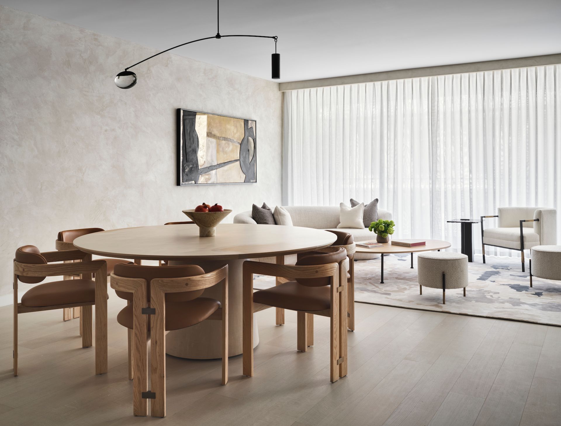 A living room with a round table and chairs