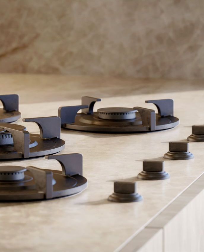 A gas stove is sitting on top of a counter in a kitchen.
