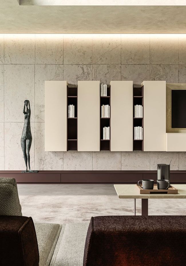 Soggiorno moderno con mobili beige, una scultura e un tavolino con tazze da caffè.