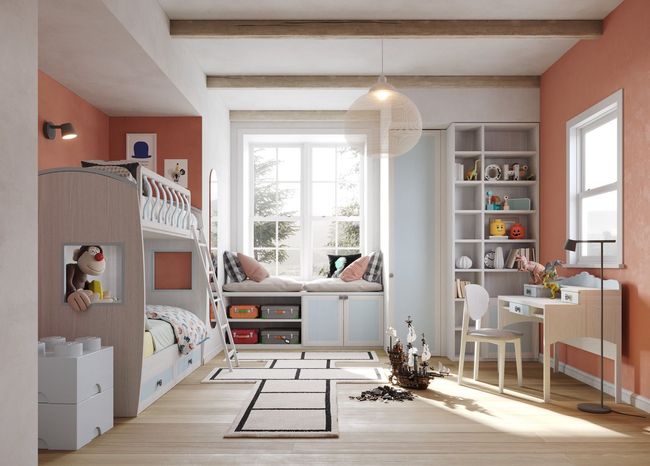 Una cameretta per bambini con letti a castello, un sedile vicino alla finestra, una scrivania e una libreria.