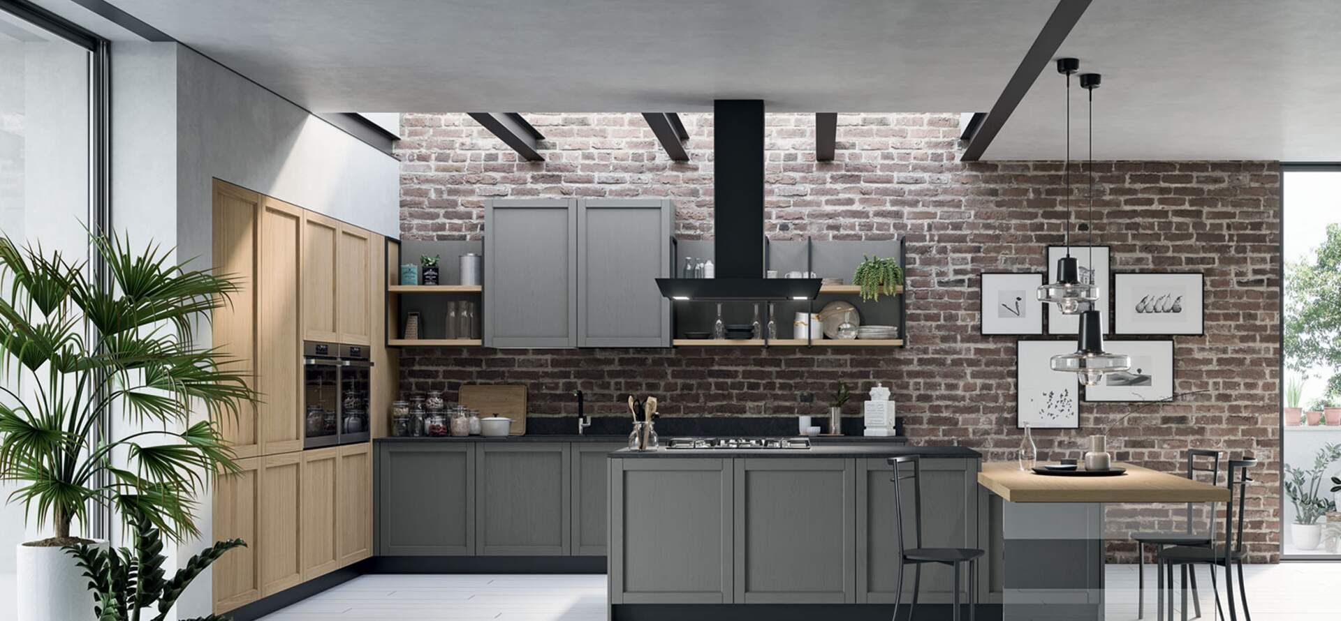 Cucina moderna con mobili grigi, parete in mattoni e tavolo da pranzo.