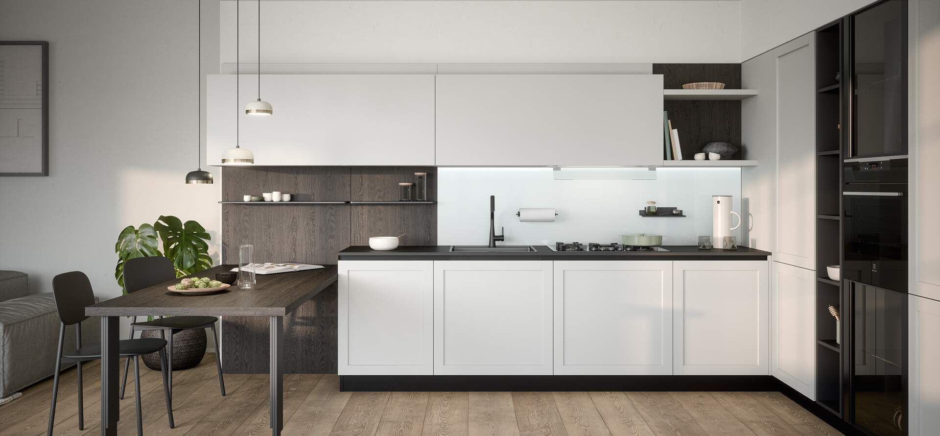 Cucina moderna con mobili bianchi, ripiani neri e tavolo da pranzo.