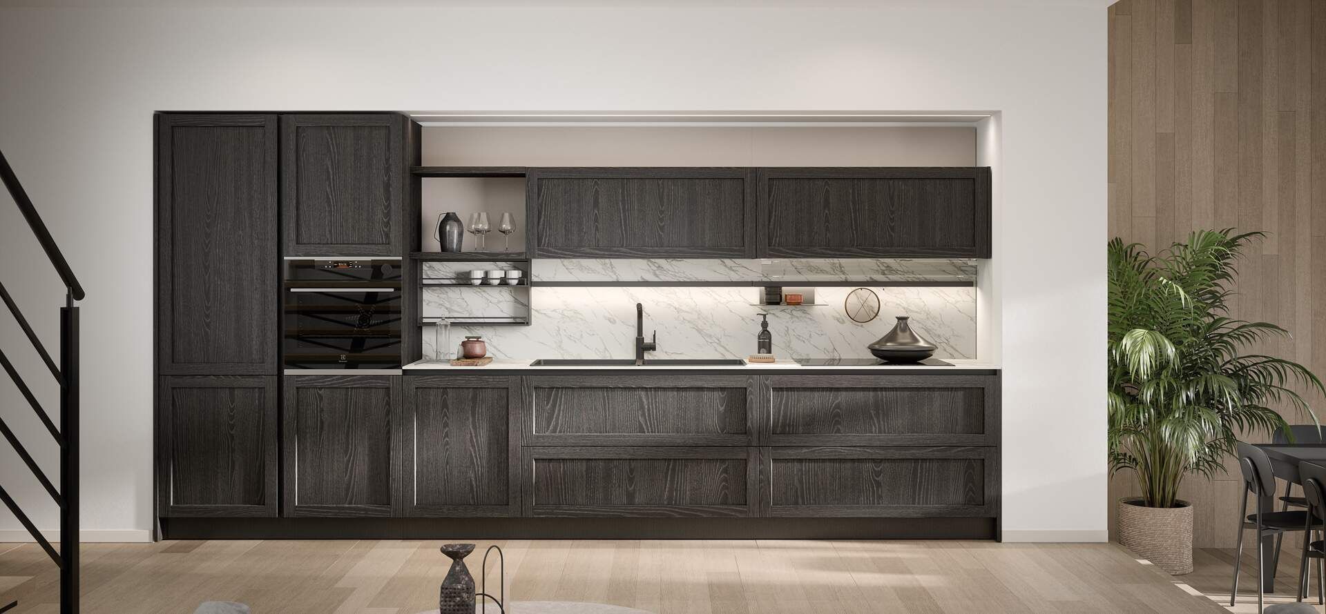 Cucina moderna con mobili in legno scuro, forno a incasso e paraschizzi in marmo.