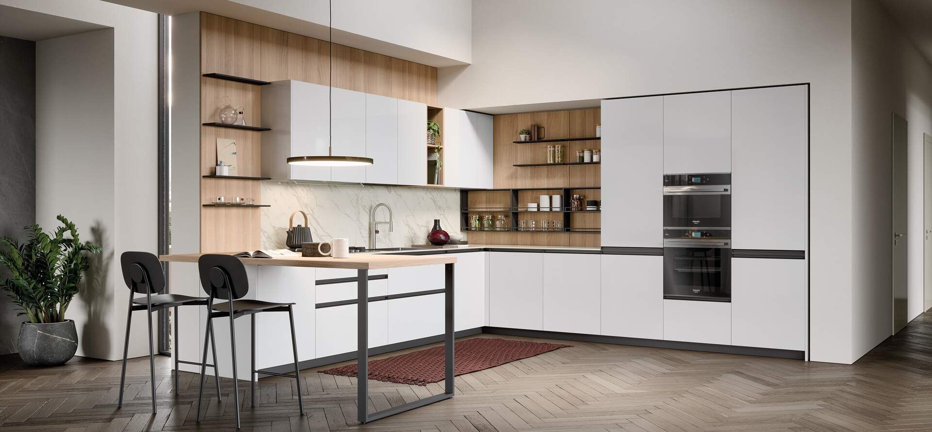 Moderna cucina bianca con dettagli in legno, isola e sgabelli da bar.