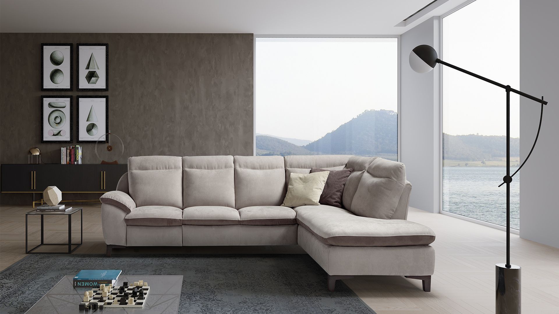 Divano componibile beige in un soggiorno moderno con vista sulle montagne.