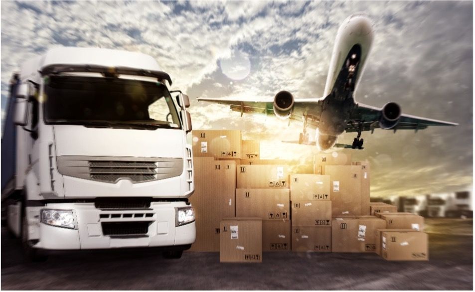 A truck is loaded with boxes and an airplane is flying in the background to illustrate how supply chain operations work.