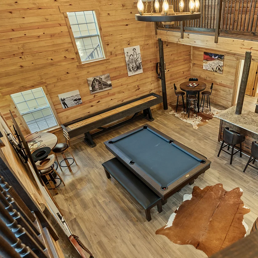 An aerial view of a living room with a pool table