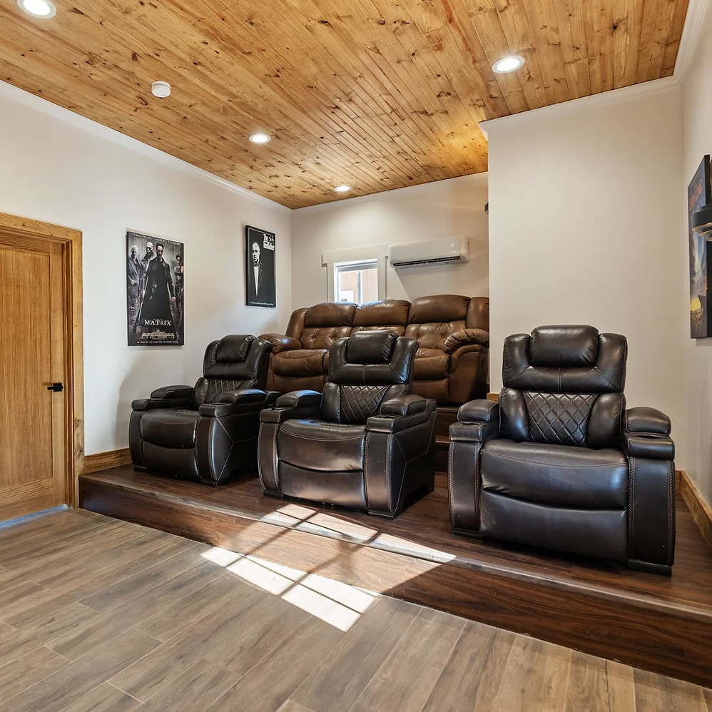 A room with a lot of chairs and a wooden ceiling