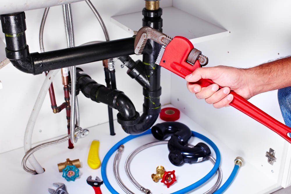 Plumber Hand with Wrench — Plumbers in Delacombe, VIC